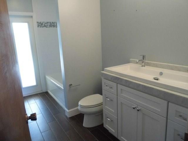 610 Southwest 17th Street Boca Raton, FL 33486 - Photo 13 of 49 a bathroom with a sink a toilet and a window