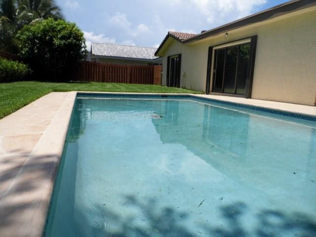 610 Southwest 17th Street Boca Raton, FL 33486 - Photo 20 of 49 a view of swimming pool with a yard