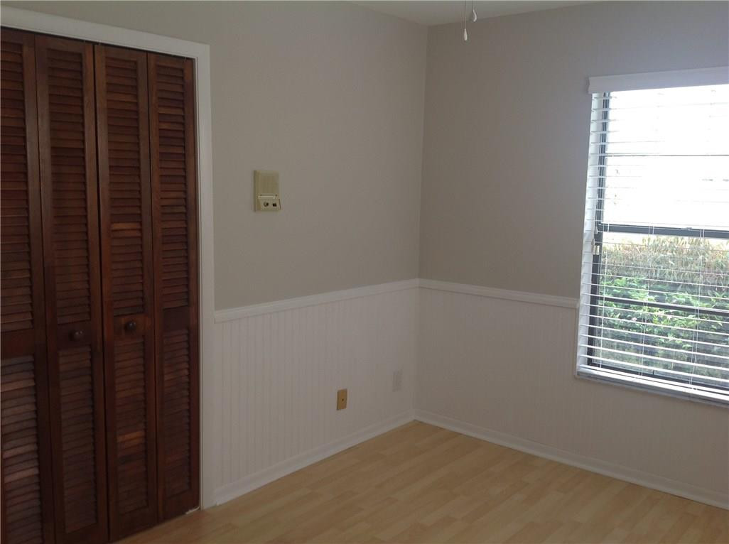 610 Southwest 17th Street Boca Raton, FL 33486 - Photo 28 of 49 wooden floor in an empty room with a window