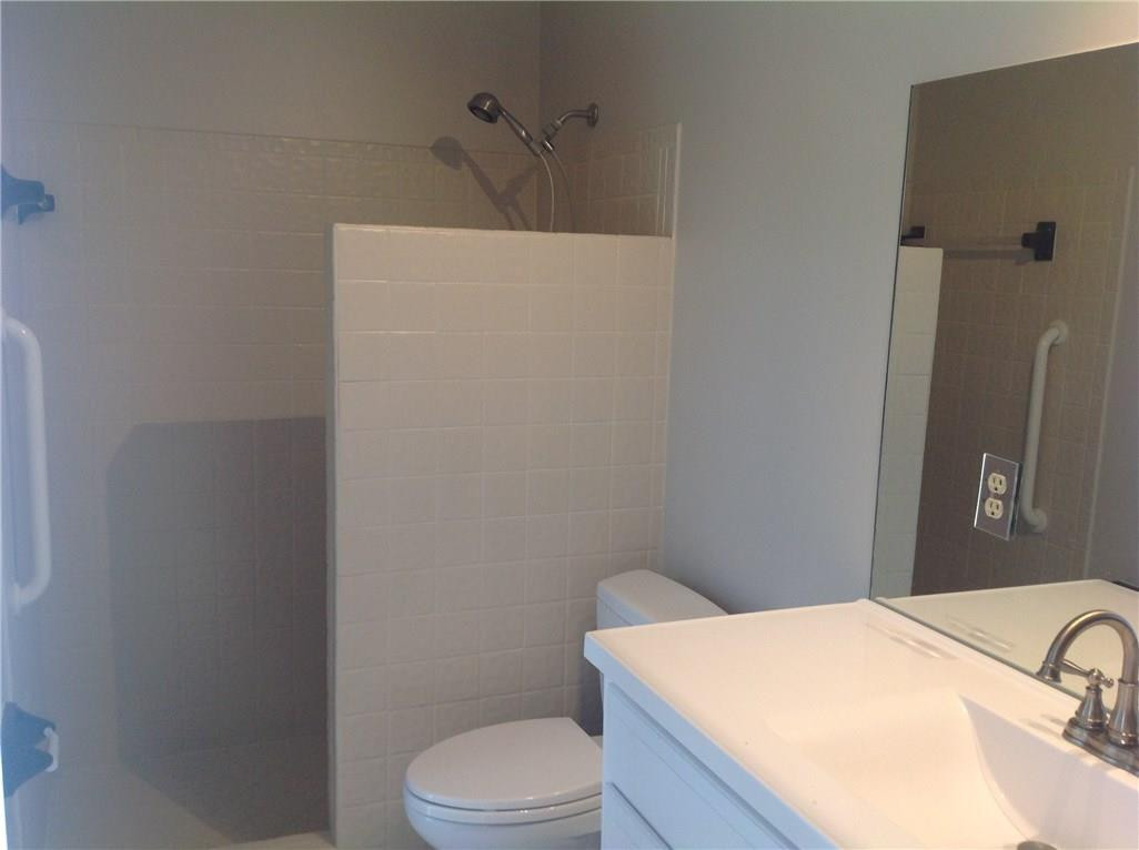 610 Southwest 17th Street Boca Raton, FL 33486 - Photo 39 of 49 a bathroom with a sink a toilet and shower