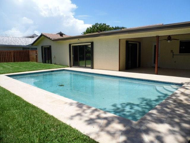 610 Southwest 17th Street Boca Raton, FL 33486 - Photo 4 of 49 a view of a house with a yard