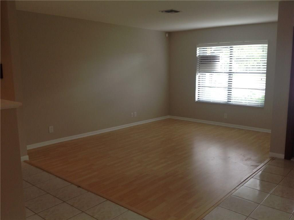 610 Southwest 17th Street Boca Raton, FL 33486 - Photo 42 of 49 an empty room with wooden floor and windows