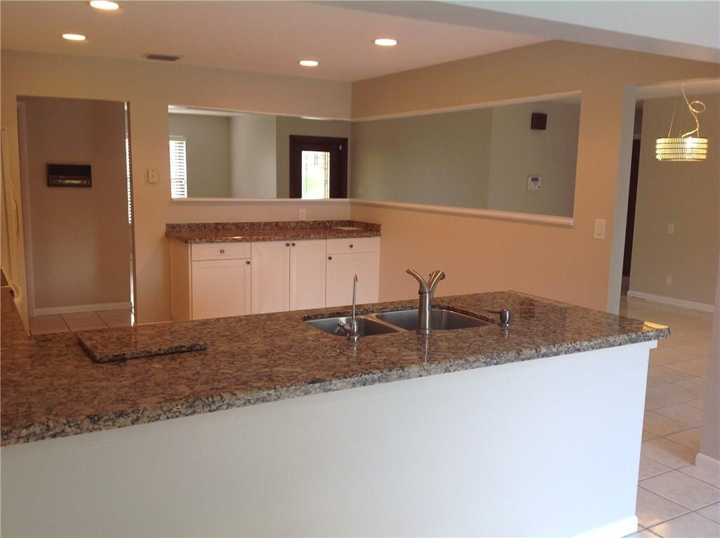 610 Southwest 17th Street Boca Raton, FL 33486 - Photo 45 of 49 a bathroom with a granite countertop sink and a mirror