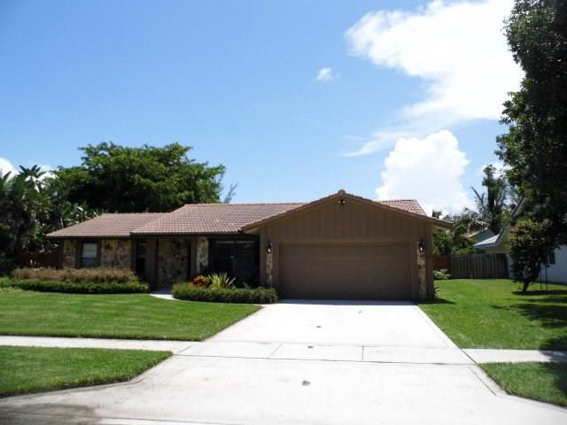 610 Southwest 17th Street Boca Raton, FL 33486 - Photo 48 of 49 a front view of house with yard