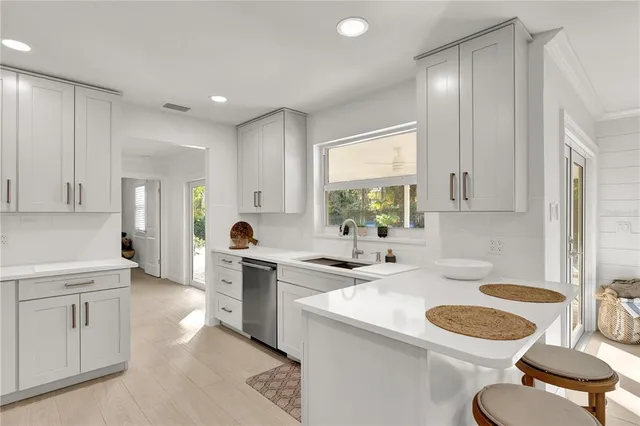 a bedroom with a bed a couch and dresser