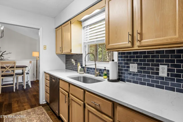 a kitchen with a sink and a window