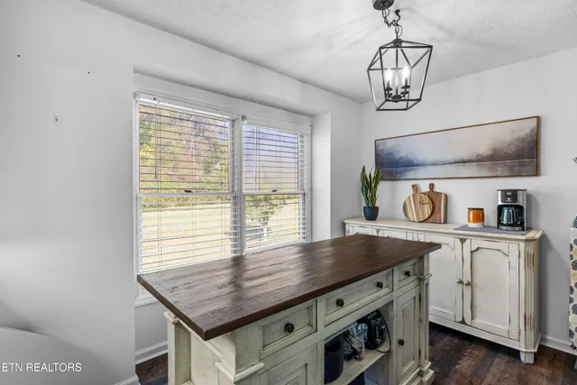 a view of kitchen center island and wooden floor
