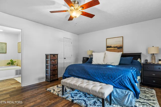 a bedroom with a bed and a book shelf