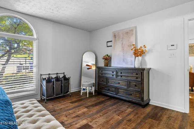 a view of a livingroom with furniture and a window