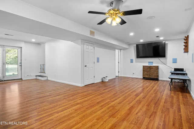 a view of livingroom with hardwood floor and a ceiling fan