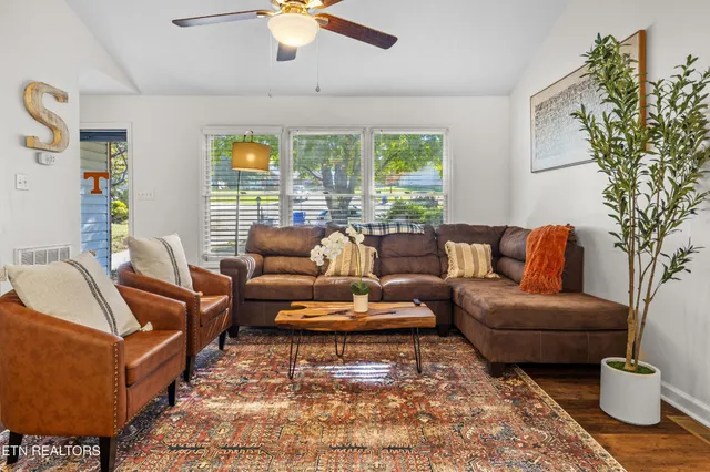 a living room with furniture and a large window