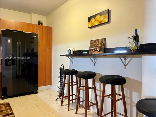 a kitchen with a table and chairs in it