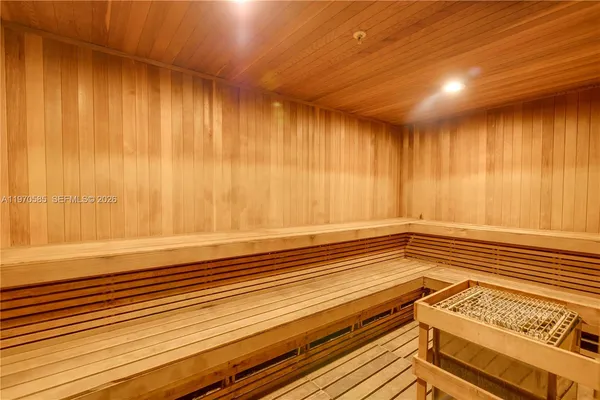 a view of a room with a wooden floor and a window