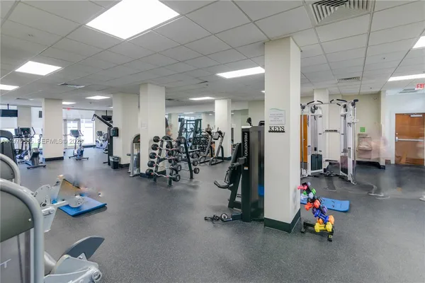 a playing room with lots of gym equipment