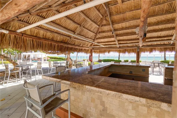 a view of a patio with a table and chairs