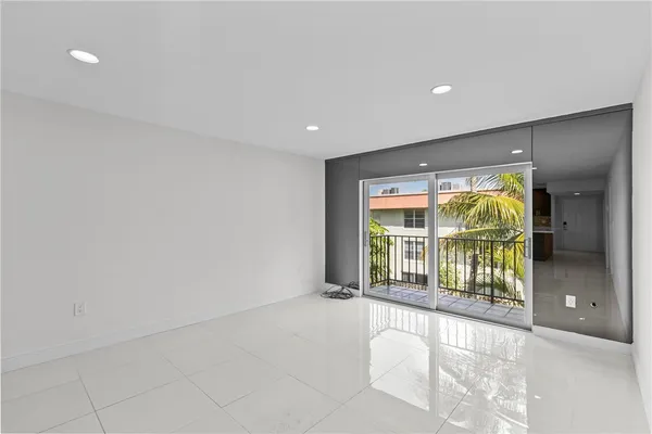 a view of an empty room with a balcony