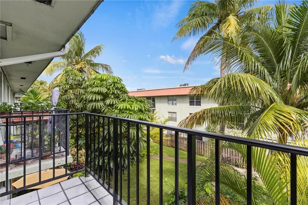 a view of a balcony with a plant