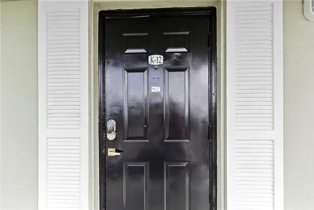 a view of hallway with wooden floor