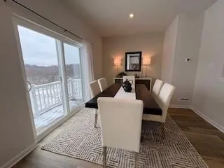 a living room with furniture rug and a table