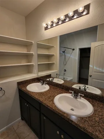 a bathroom with a tub and a shower