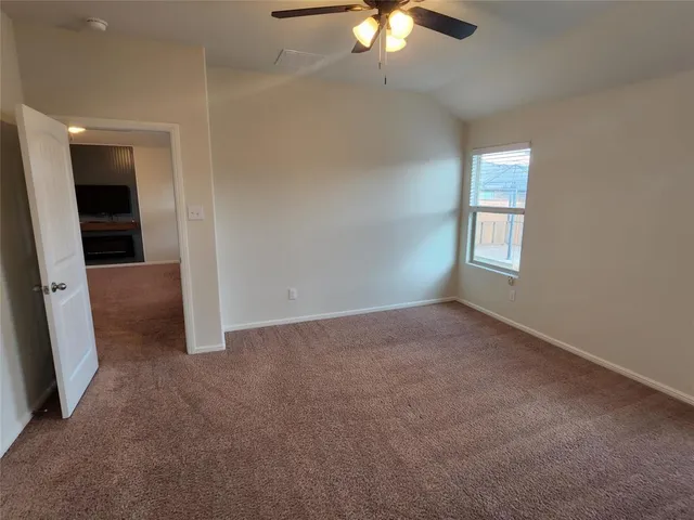 a view of a kitchen with a sink and a refrigerator