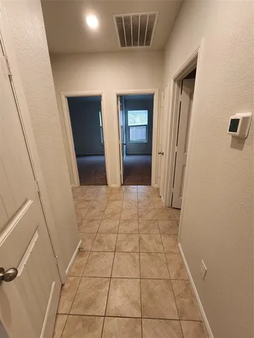 a kitchen with a sink and granite counter top