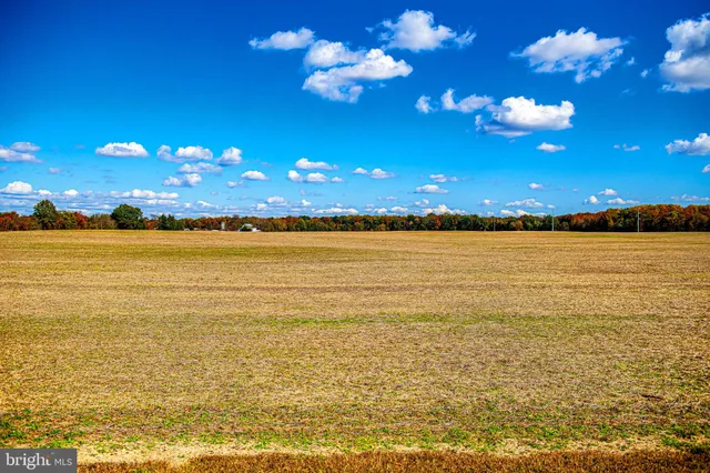 a view of swimming pool with outdoor seating