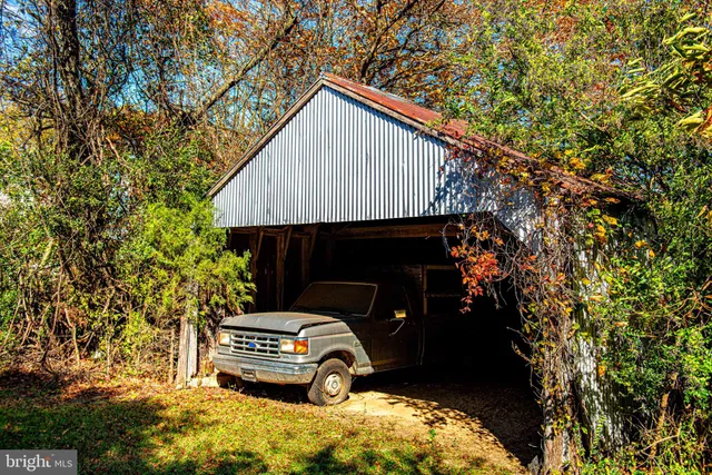 a view of a bench in front of house