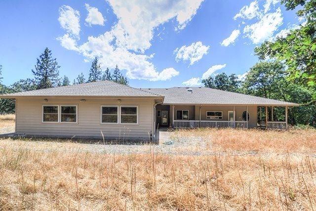 6555 Hugo Road Grants Pass, OR 97526 - Photo 29 of 31 Shows workshop area and covered patio.