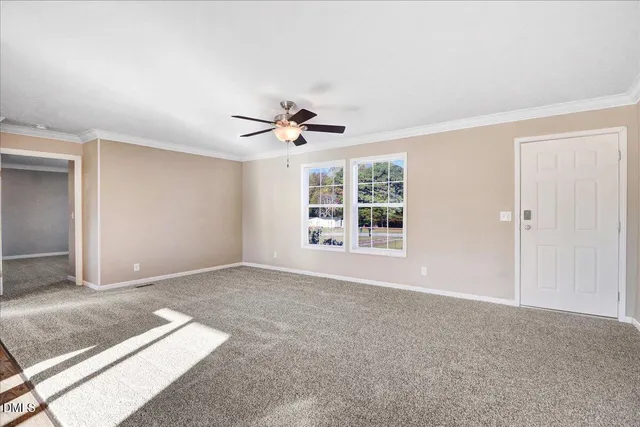 a view of an empty room with a window