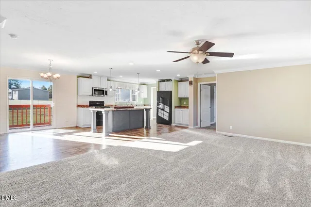 a view of a kitchen with a sink and microwave