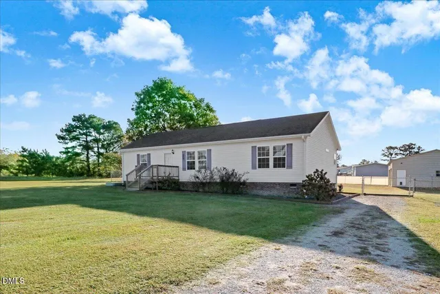 a house view with a garden space