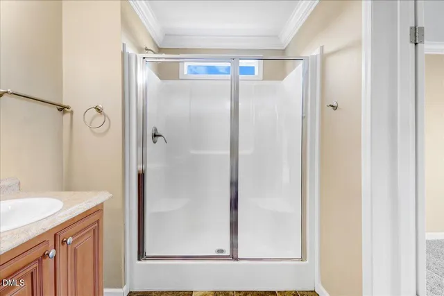 a bathroom with a shower and a sink