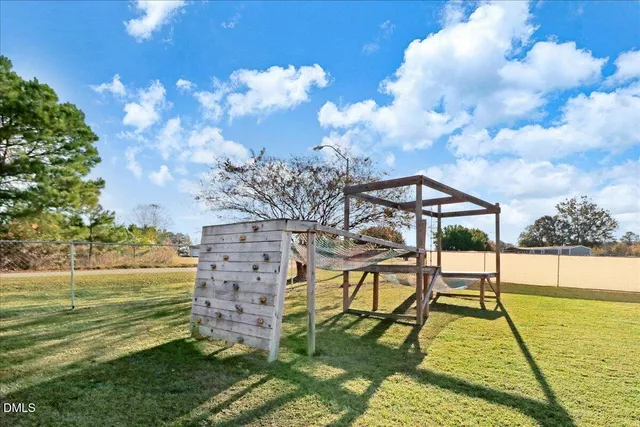 a view of a swimming pool with a yard