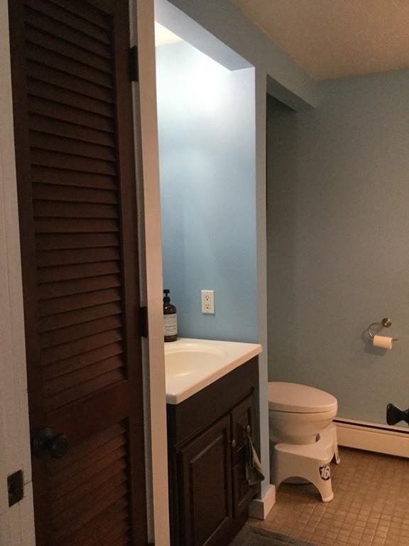 5 Ash Road Charlton, MA 01507 - Photo 16 of 27 a bathroom with a sink a toilet and shower