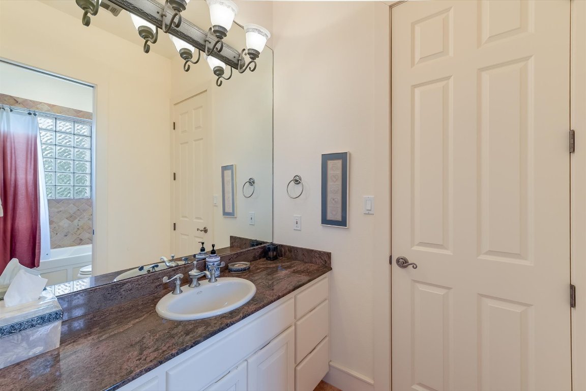 1001 Wesley Ridge Drive Spicewood, TX 78669 - Photo 16 of 35 Bathroom featuring vanity and toilet