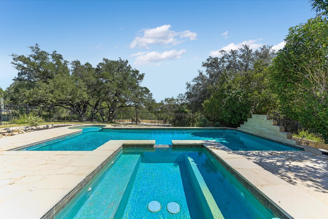 1001 Wesley Ridge Drive Spicewood, TX 78669 - Photo 21 of 35 View of swimming pool with a patio and a pool with connected hot tub