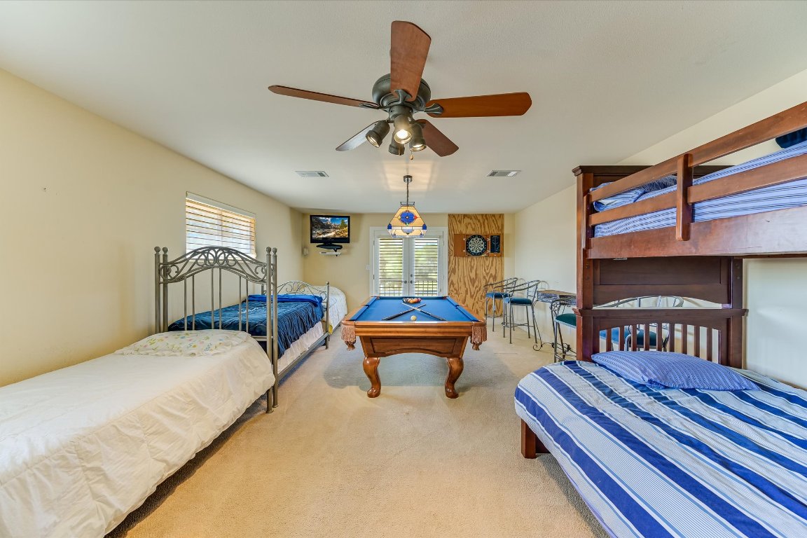 1001 Wesley Ridge Drive Spicewood, TX 78669 - Photo 22 of 35 Bedroom with carpet floors and ceiling fan