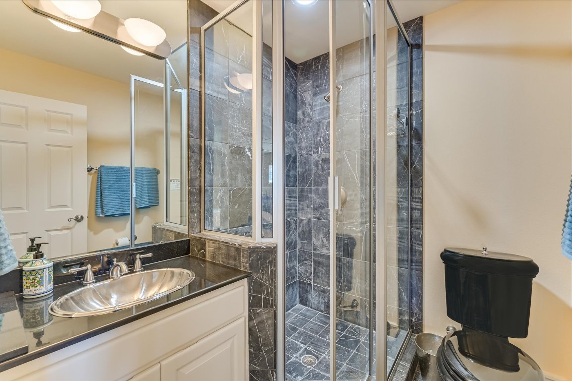 1001 Wesley Ridge Drive Spicewood, TX 78669 - Photo 24 of 35 Full bath featuring a stall shower and vanity