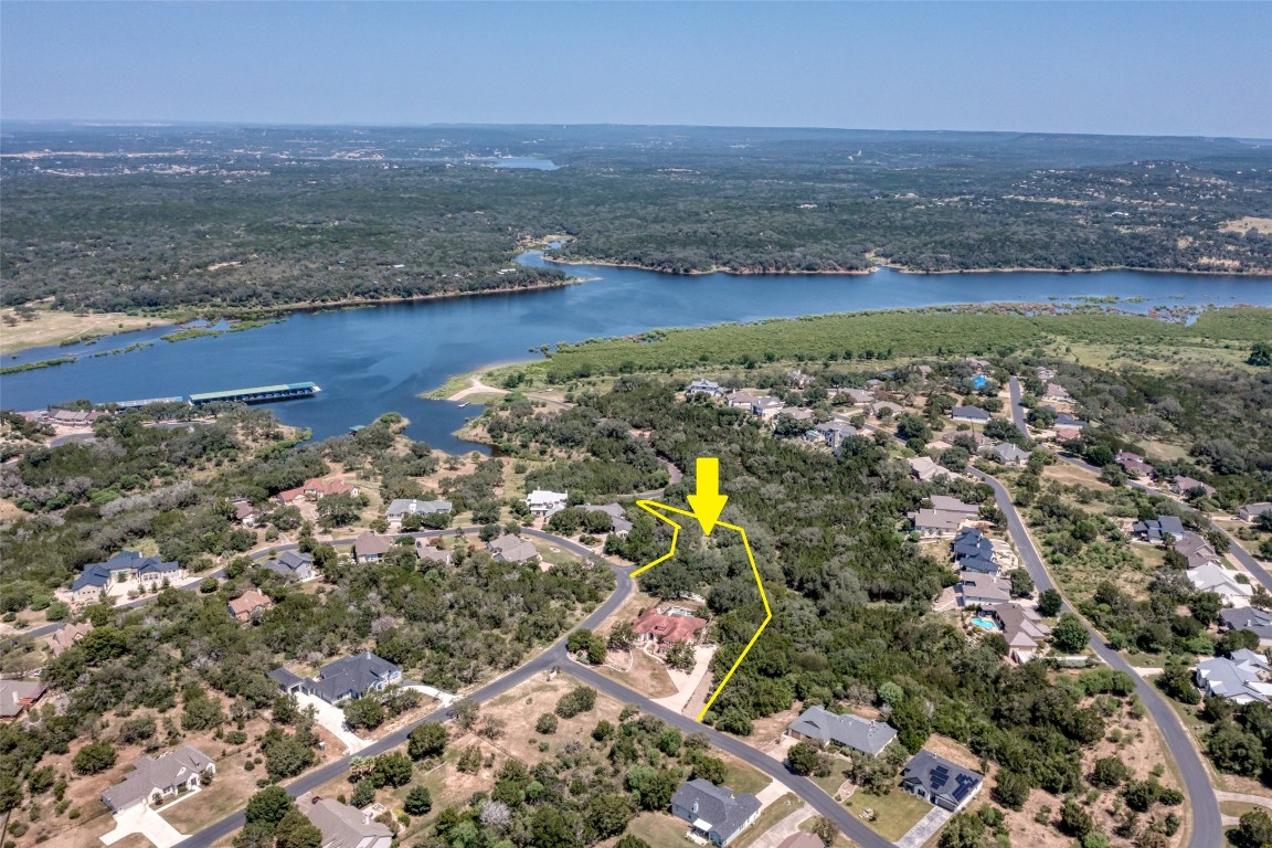 1001 Wesley Ridge Drive Spicewood, TX 78669 - Photo 32 of 35 Aerial view of residential area featuring a nearby body of water