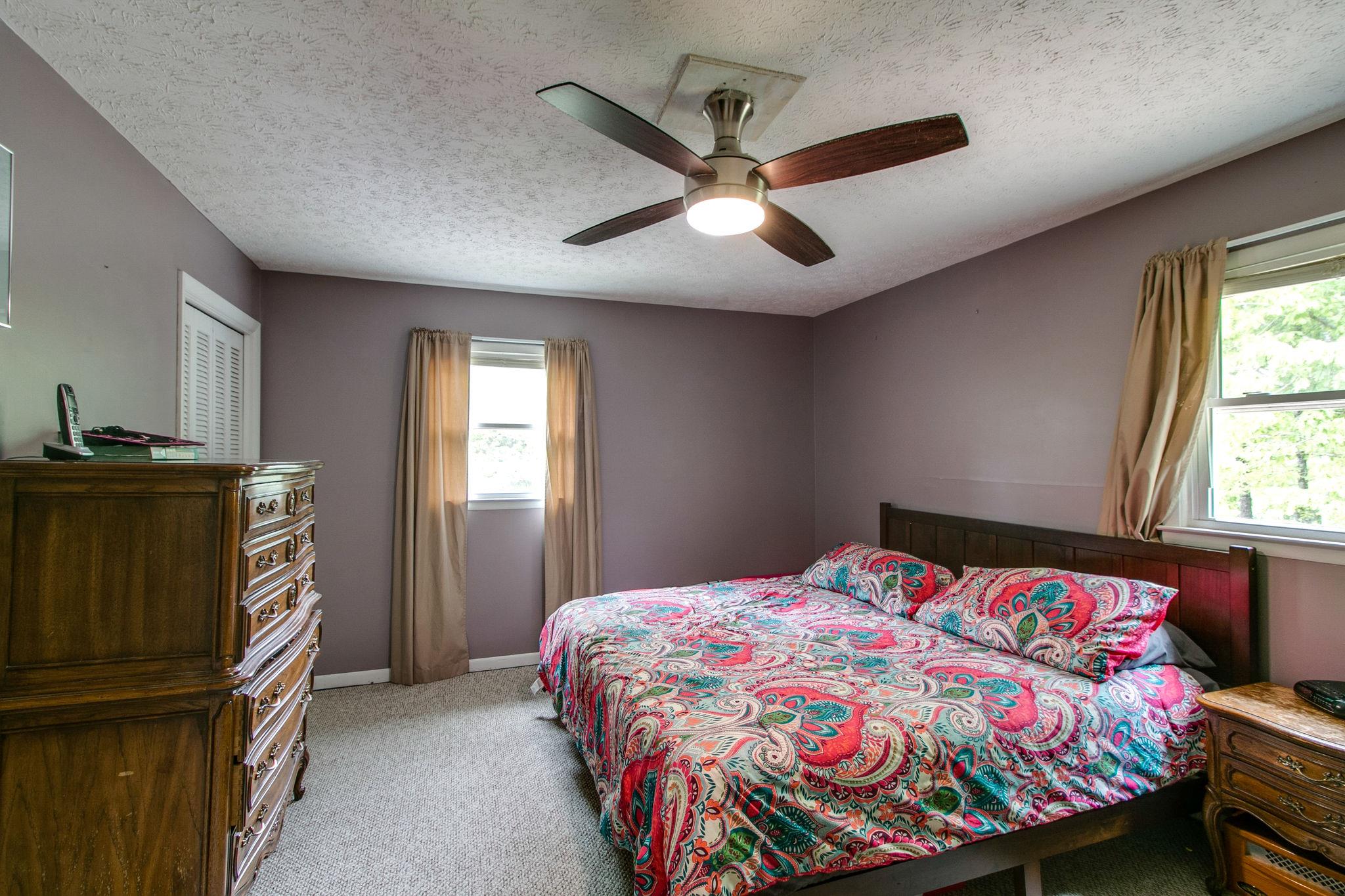 330 Cooley Ford Road Tennessee Ridge, TN 37178 - Photo 13 of 29 a bedroom with a bed and a window
