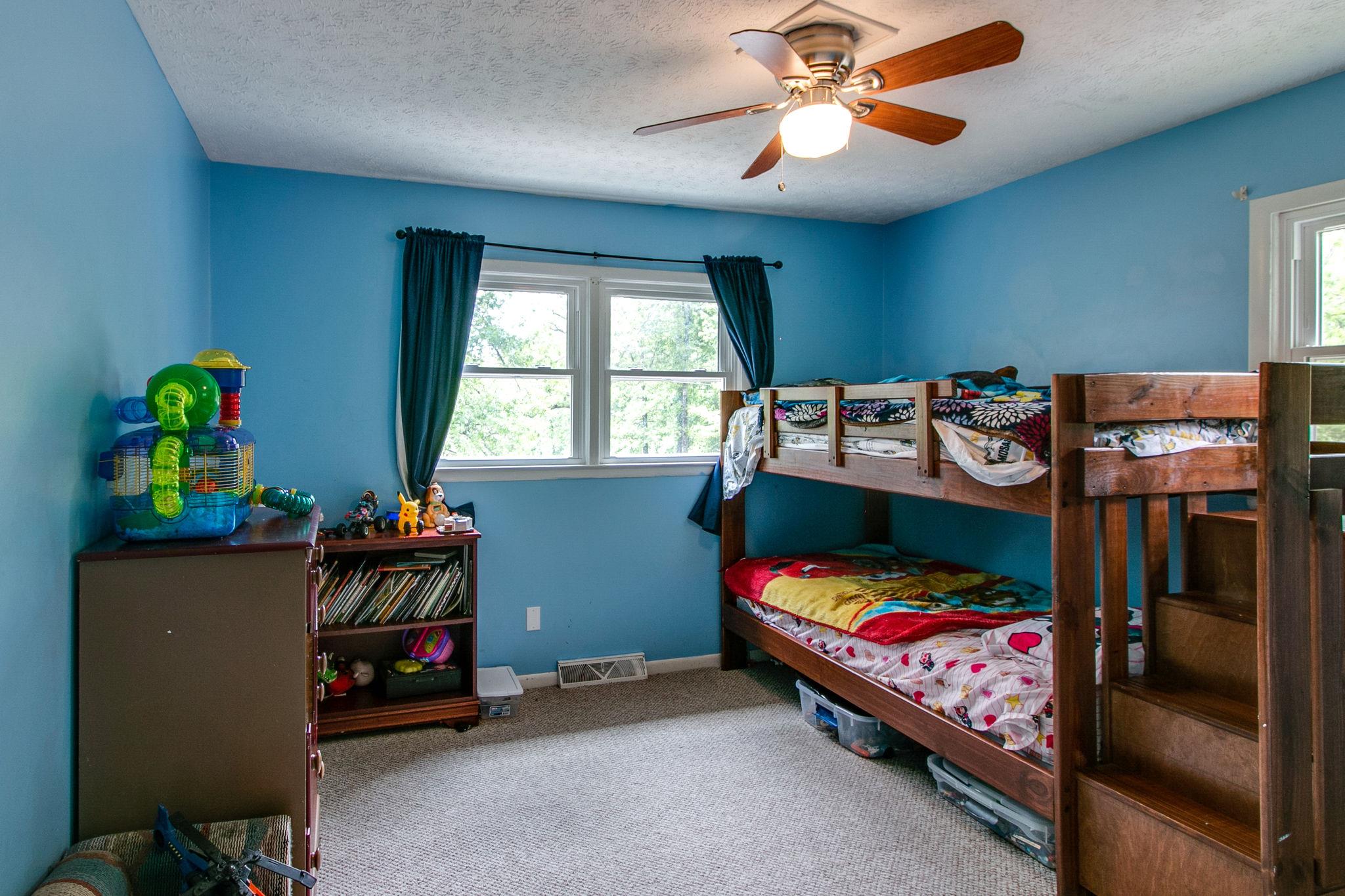 330 Cooley Ford Road Tennessee Ridge, TN 37178 - Photo 14 of 29 a bedroom with a bed and a tv