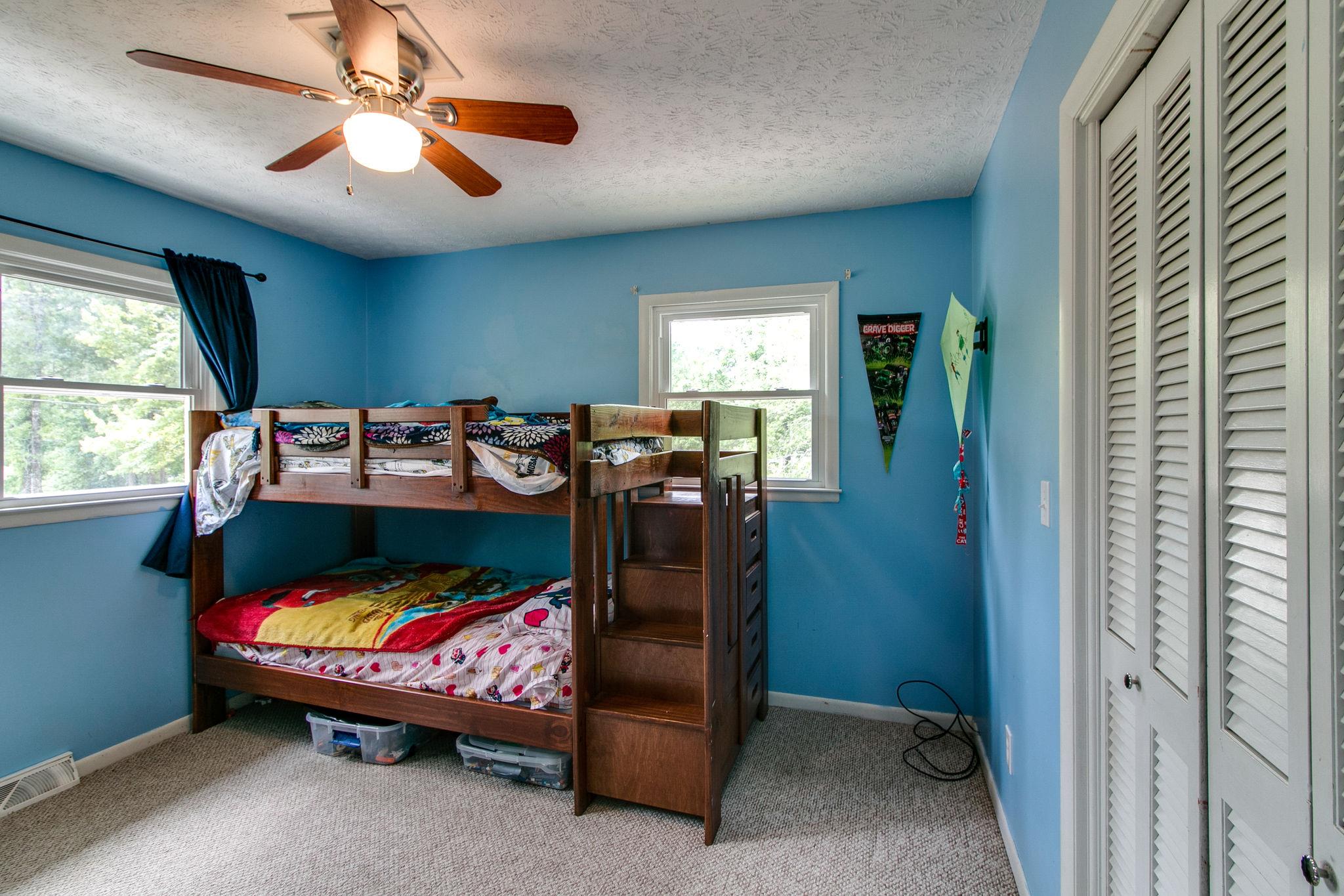 330 Cooley Ford Road Tennessee Ridge, TN 37178 - Photo 15 of 29 a bedroom with furniture and window
