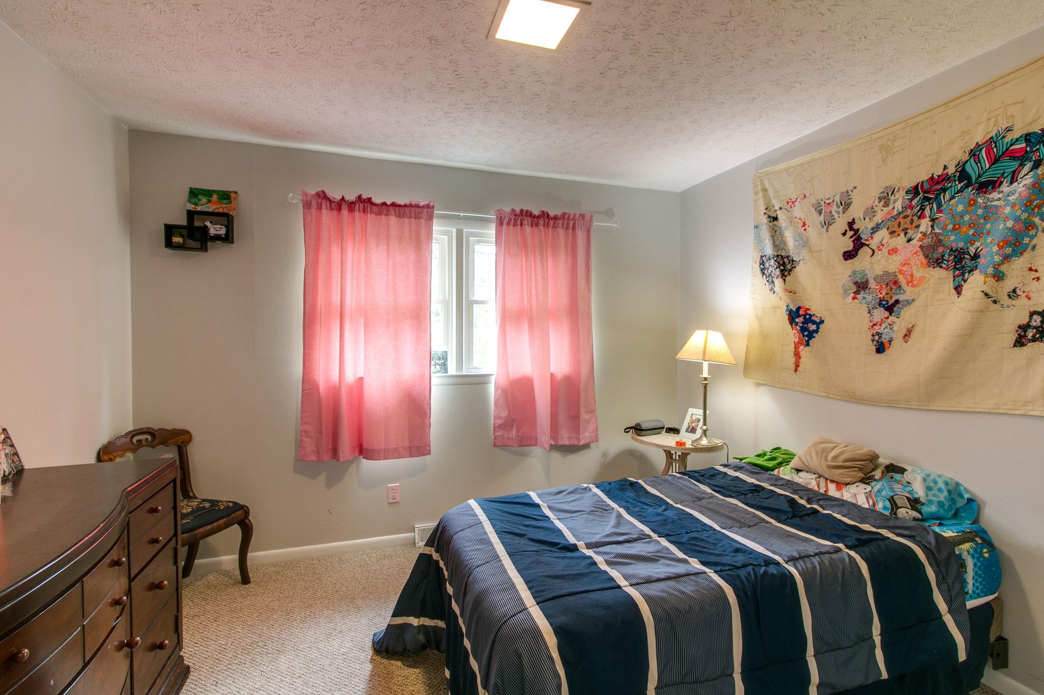 330 Cooley Ford Road Tennessee Ridge, TN 37178 - Photo 17 of 29 a bedroom with a bed and a window