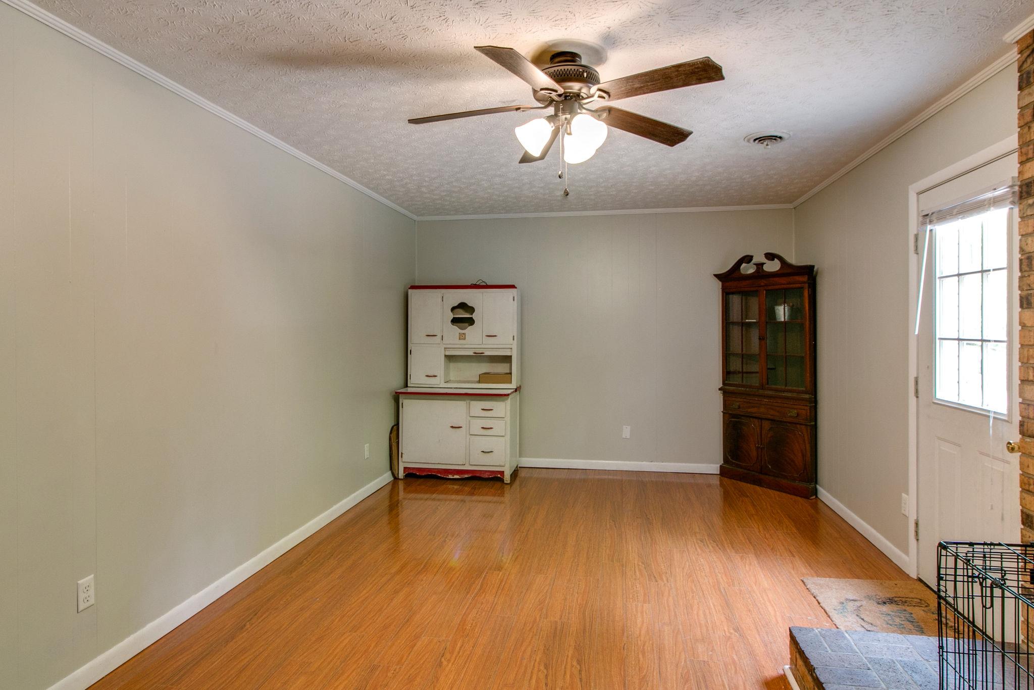 330 Cooley Ford Road Tennessee Ridge, TN 37178 - Photo 18 of 29 wooden floor in an empty room with a window