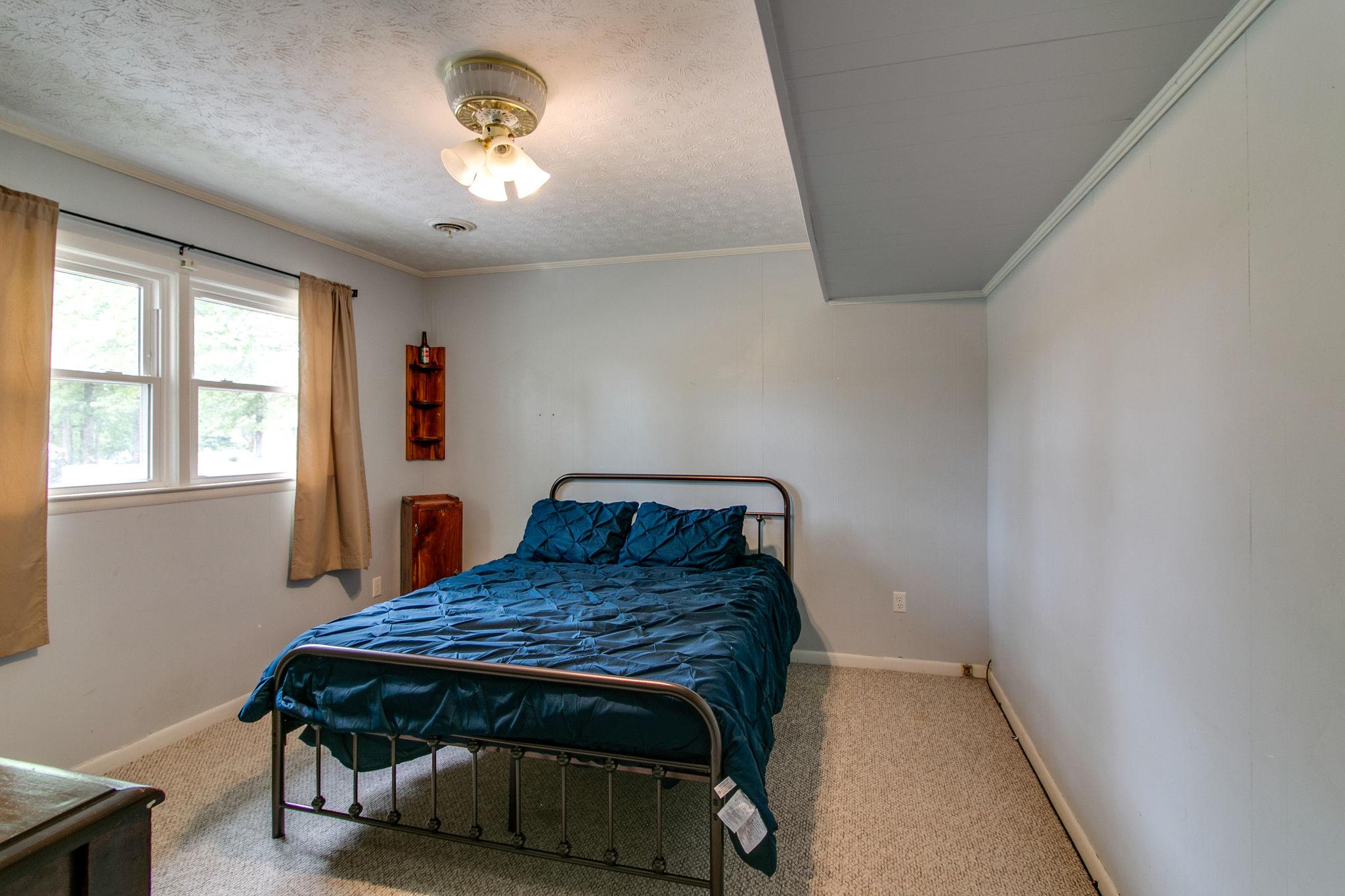 330 Cooley Ford Road Tennessee Ridge, TN 37178 - Photo 21 of 29 a bedroom with a bed and a window