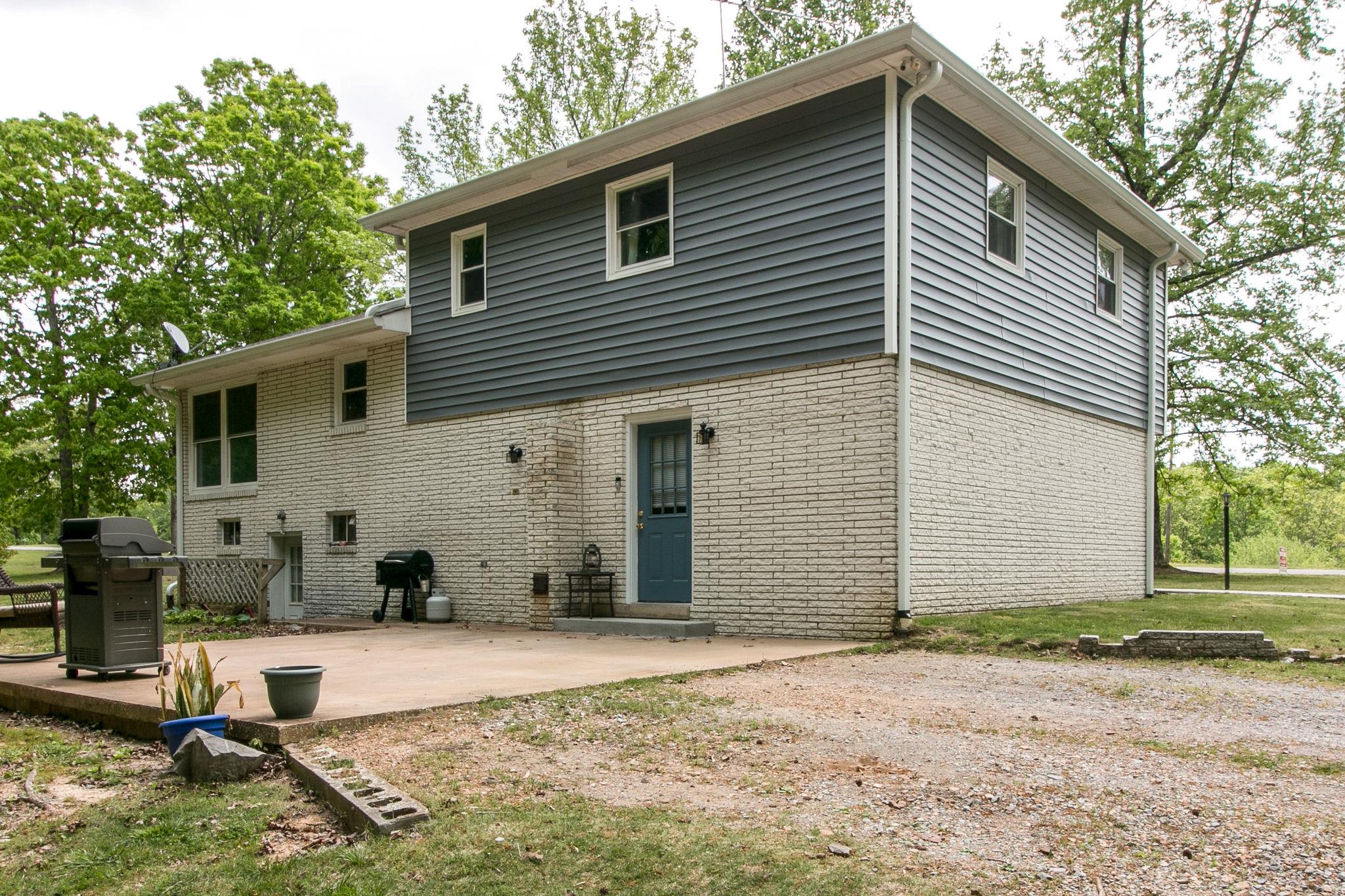 330 Cooley Ford Road Tennessee Ridge, TN 37178 - Photo 26 of 29 a front view of a house with patio