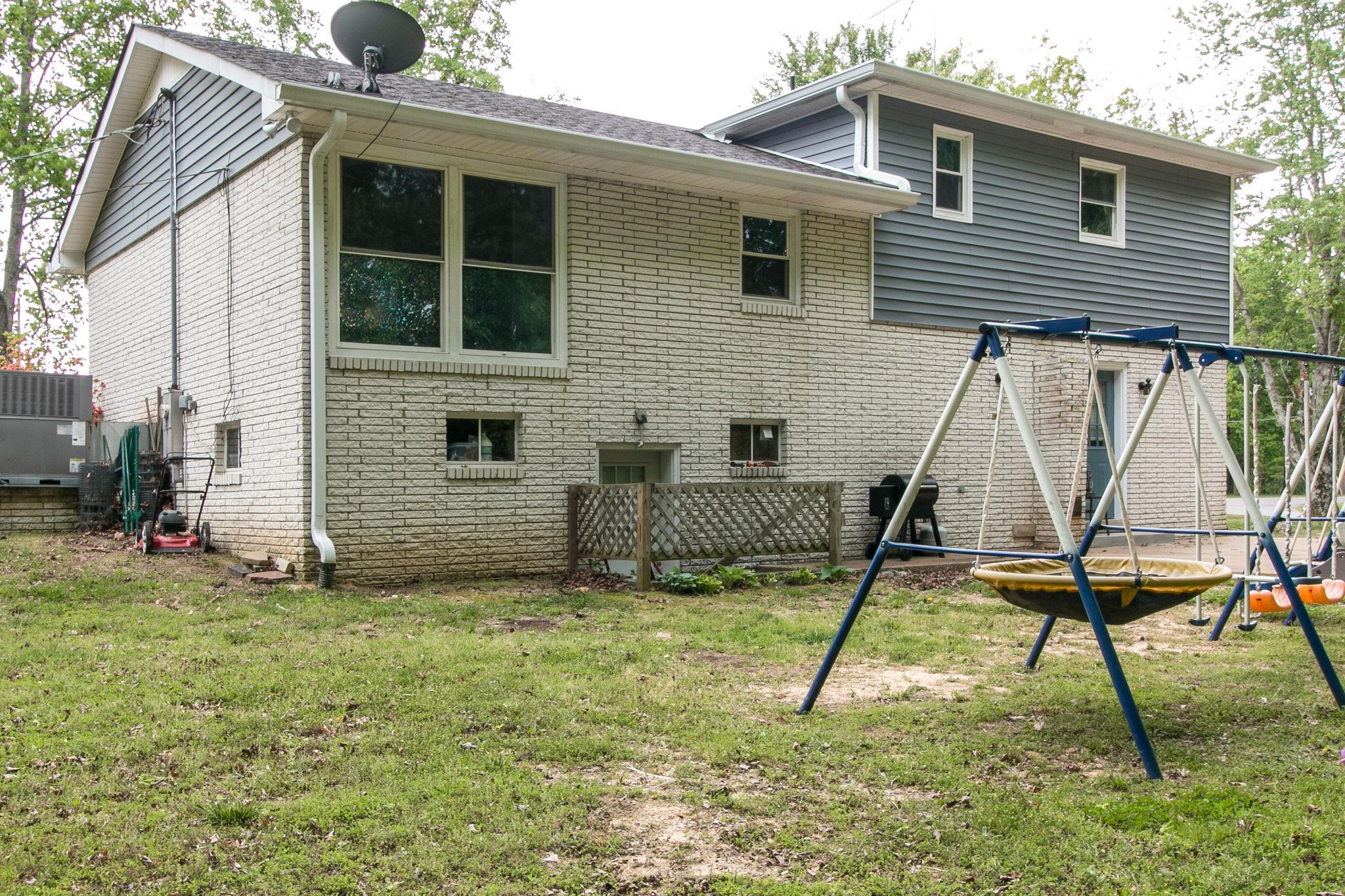 330 Cooley Ford Road Tennessee Ridge, TN 37178 - Photo 27 of 29 a view of a house with a backyard