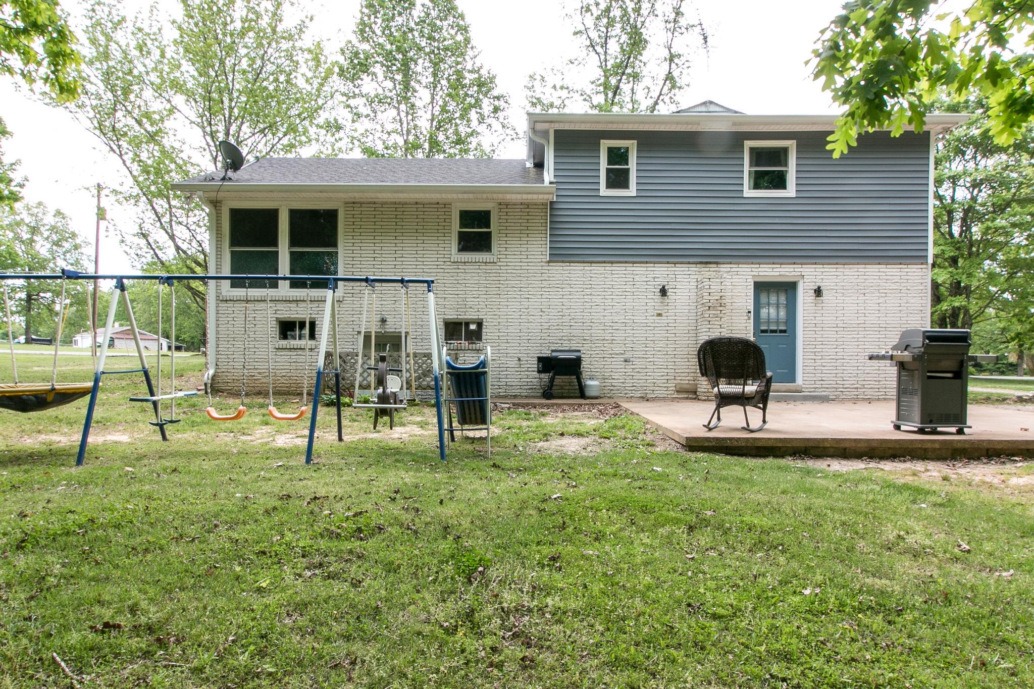 330 Cooley Ford Road Tennessee Ridge, TN 37178 - Photo 29 of 29 a view of house with a backyard and a chair