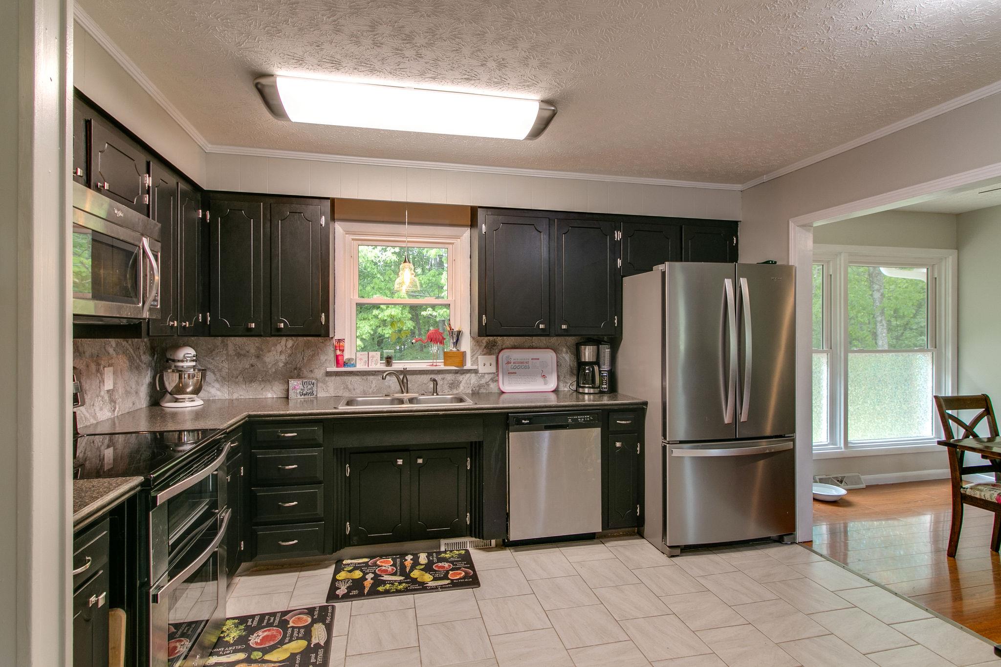 330 Cooley Ford Road Tennessee Ridge, TN 37178 - Photo 7 of 29 a kitchen with a sink appliances and cabinets
